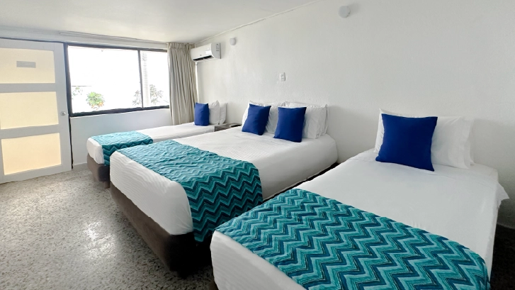 On Vacation Colombia destino nacional hotel blue reef habitación estándar triple