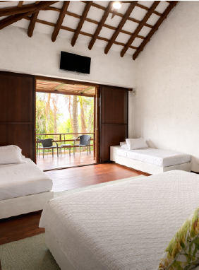 Vista parcial al mar, Acomodación Superior Cuádruple: 1 cama doble,  2 camas sencillas, capacidad: 4 personas                Ver más                        Habitación Tierra